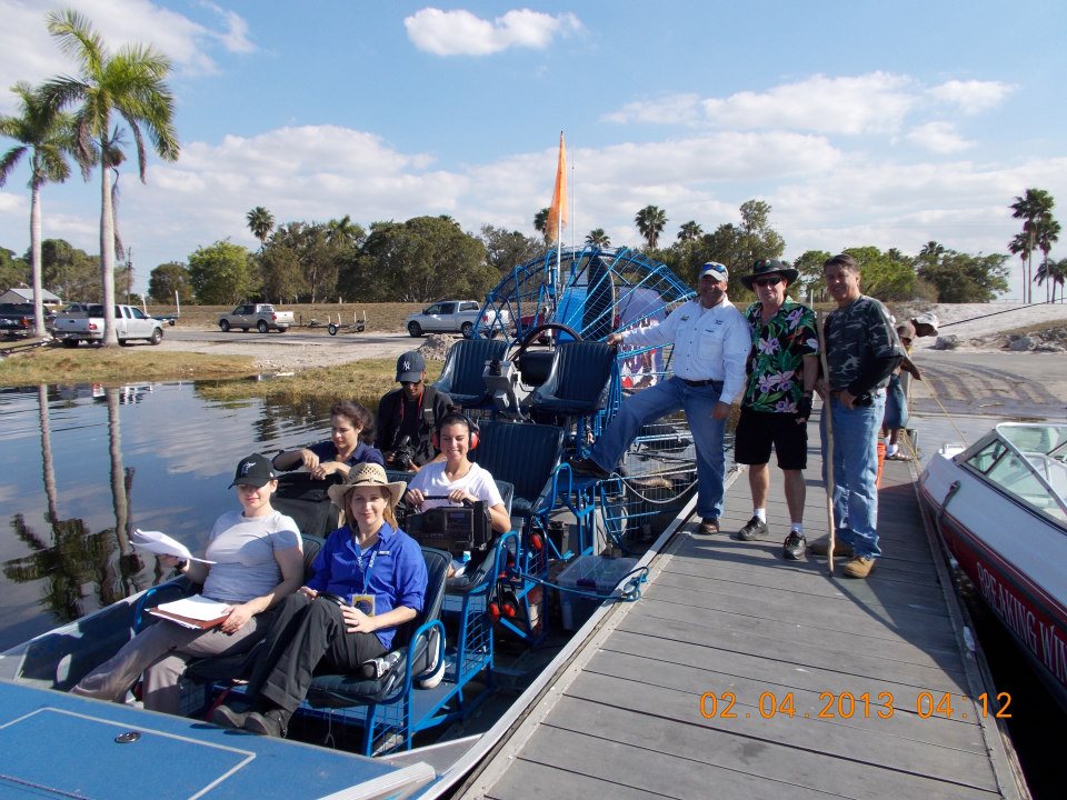 a group of tourists on a Ride The Wind boat